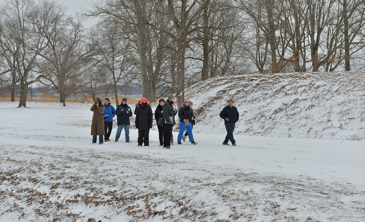 Students touring the Great Circle earthworks, part of the Newark Earthworks in the snow. Image courtesy of Timothy E. Black.