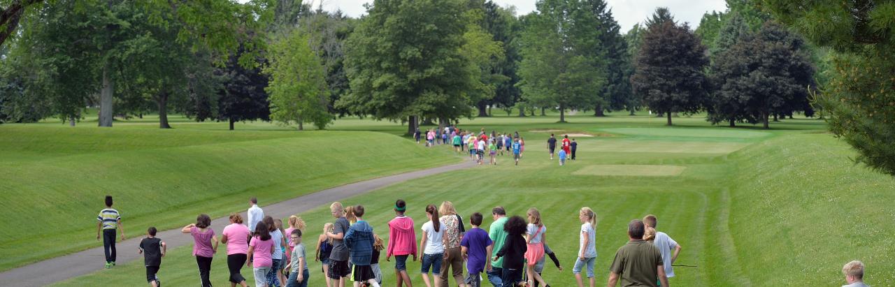Students and members of the public walking at the Great Circle, part  of the Newark Earthworks, Heath OH. Image courtesy of Timothy E. Black.