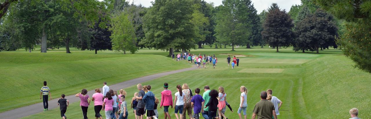 Students and members of the public walking at the Great Circle, part of the Newark Earthworks, Heath OH. Image courtesy of Timothy E. Black.