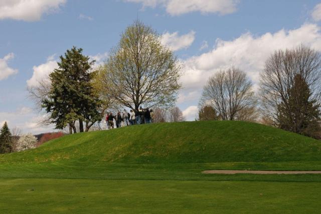 Distance view of a tour group on top of the Newark Earthworks. Image courtesy of Timothy E. Black.