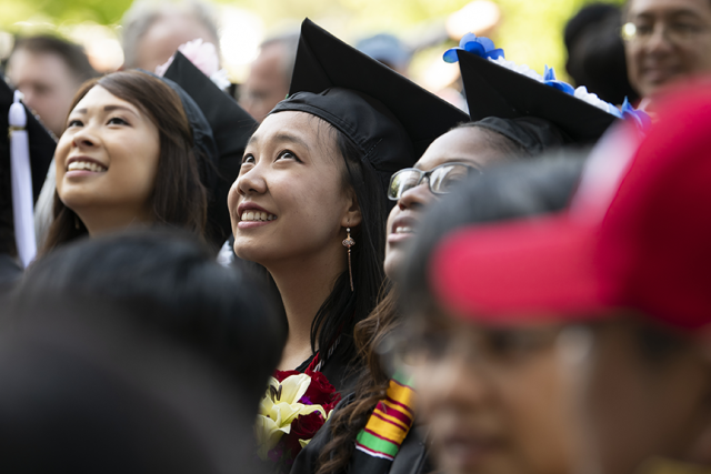 Students at commencement with their families. Image courtesy of The Ohio State University.