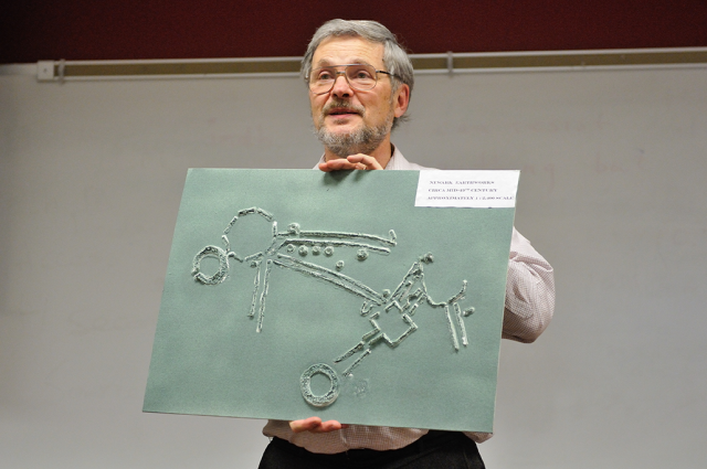 Reference and Special Collections Librarian John Crissinger holding up a raised map of the Newark Earthworks that is part of the Ohio Native Heritage Archives. Image courtesy of Timothy E. Black.