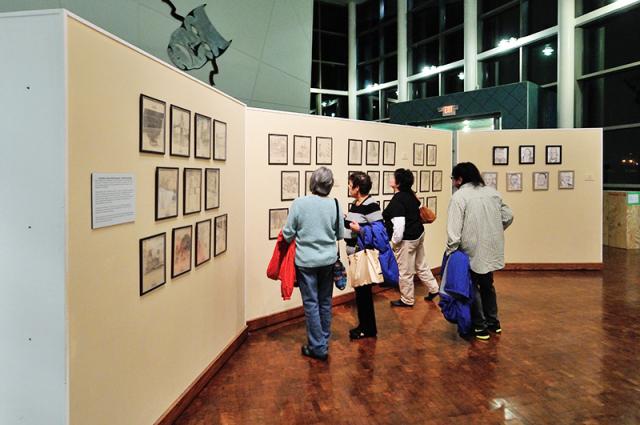 Visitors walking the gallery show of Candi Wesaw's My Dream Show at LeFevre Art Gallery. Image courtesy of The Ohio State University.