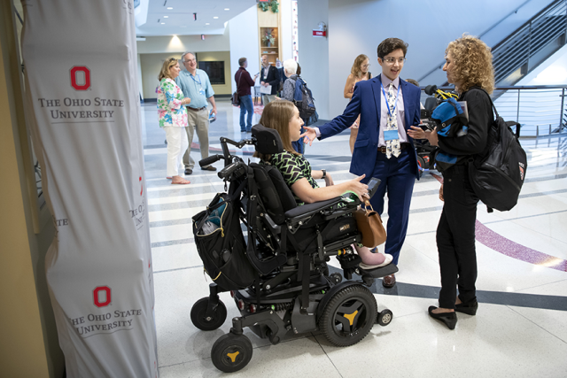 Student in a mobility assistance device successfully presenting at SciAccess conference. Image courtesy of The Ohio State University.