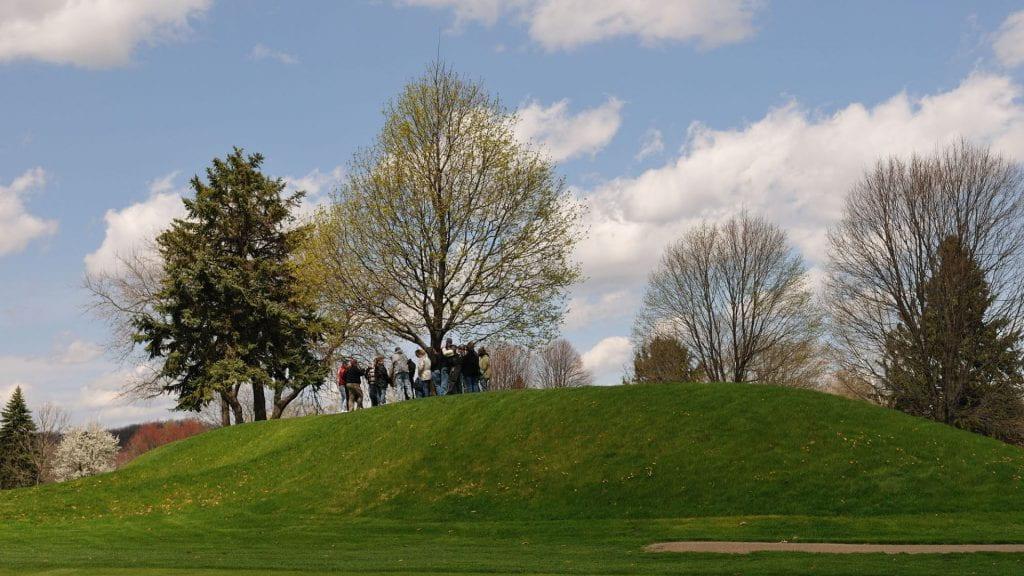 Distance view of a tour group on top of the Newark Earthworks. Image courtesy of Timothy E. Black.