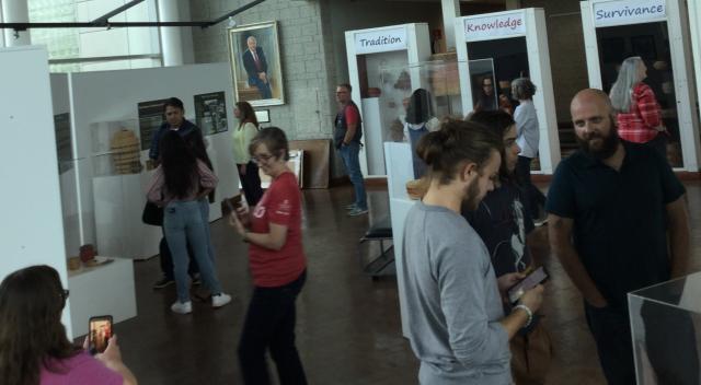 People exploring art exhibit