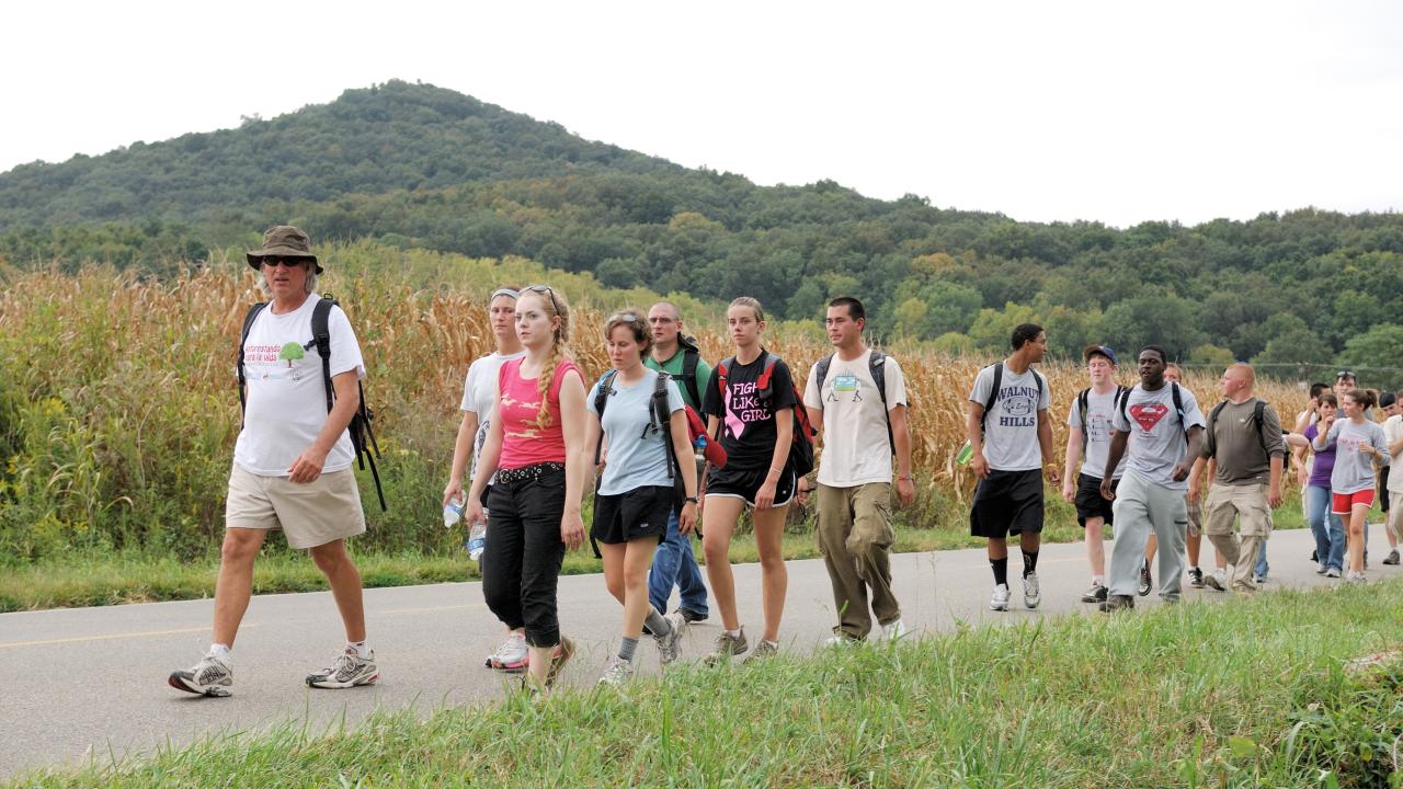 Ohio State students participating in the Earthworks Pilgrimage as part of the Newark Earthwork's Center's Walk with the Ancients resume their walk after a visit to Great Seal State Park north of Chillicothe, Ohio, Saturday, Sept. 11, 2010. In the background is the peak of Sugarloaf Mountain. Image courtesy by Timothy E. Black.